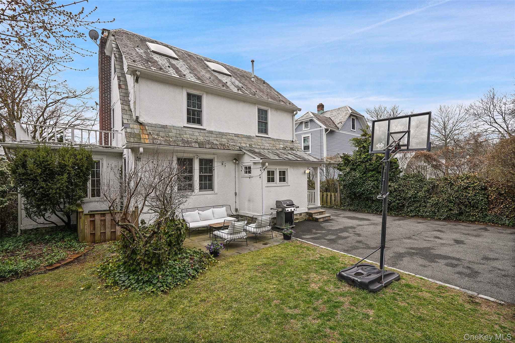 22 Brookdale Place Rye, NY 10580 - Photo 23 of 28 Great entertaining space with patio and ample space for recreation