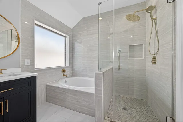 a bathroom with a bathtub and a sink