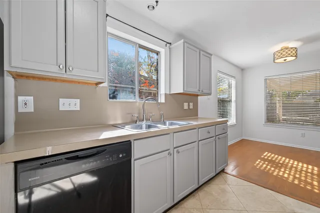 a kitchen with a sink and cabinets