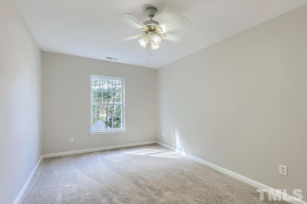 8610 Neuse Landing Lane, Unit 109 Raleigh, NC 27616 - Photo 13 of 28 a view of an empty room with a window