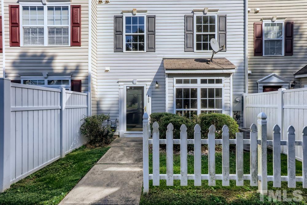 8610 Neuse Landing Lane, Unit 109 Raleigh, NC 27616 - Photo 3 of 28 a front view of house and yard with green space