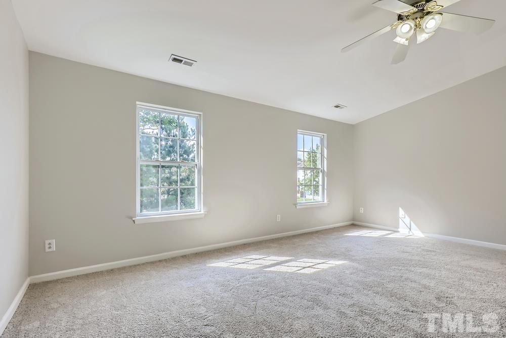 8610 Neuse Landing Lane, Unit 109 Raleigh, NC 27616 - Photo 21 of 28 a view of an empty room with a window