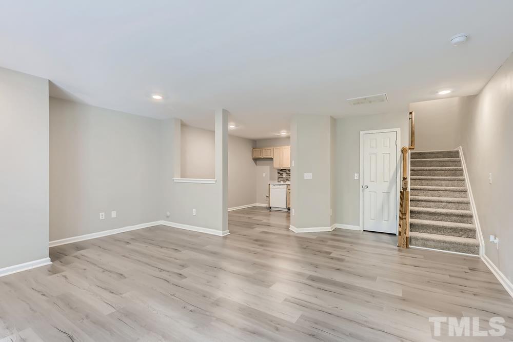8610 Neuse Landing Lane, Unit 109 Raleigh, NC 27616 - Photo 7 of 28 a view of empty room with wooden floor