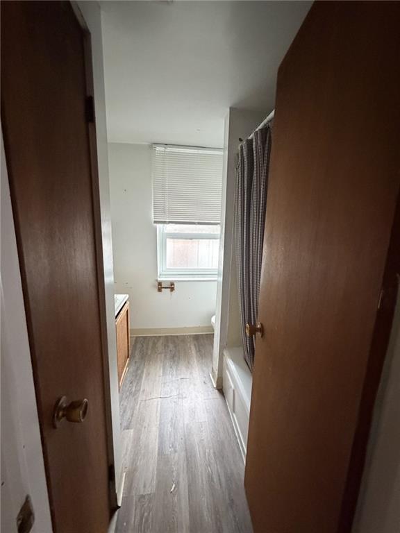 5807 Bartlett Street, Unit 5 Pittsburgh, PA 15217 - Photo 17 of 18 an empty room with wooden floor and a window