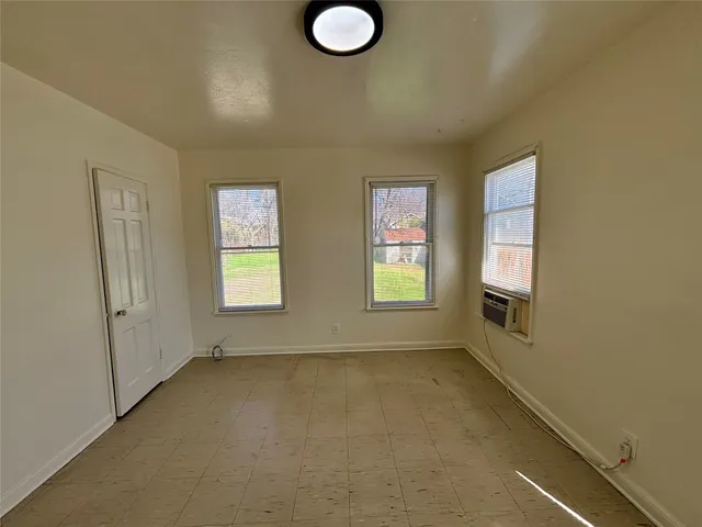 an empty room with windows