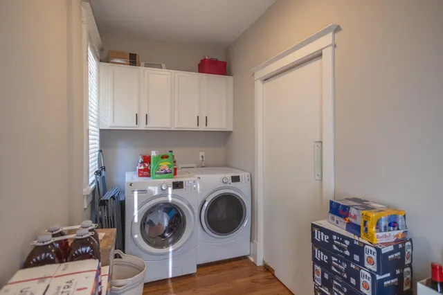 a utility room with sink dryer and washer