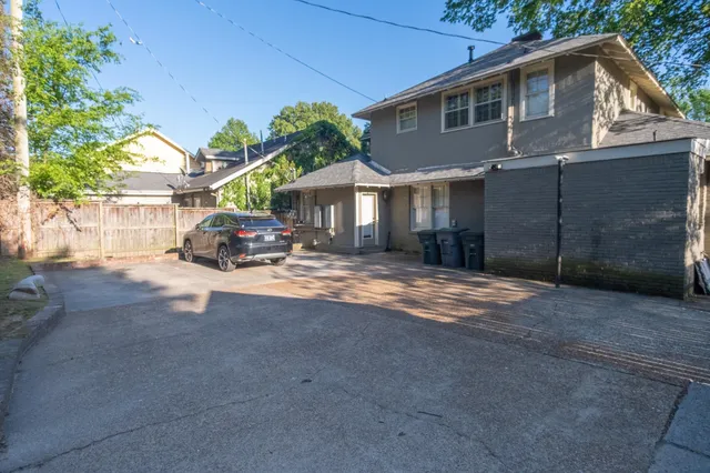 a car parked in front of a house