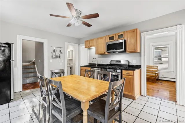 a view of a dining room with furniture and wooden floor