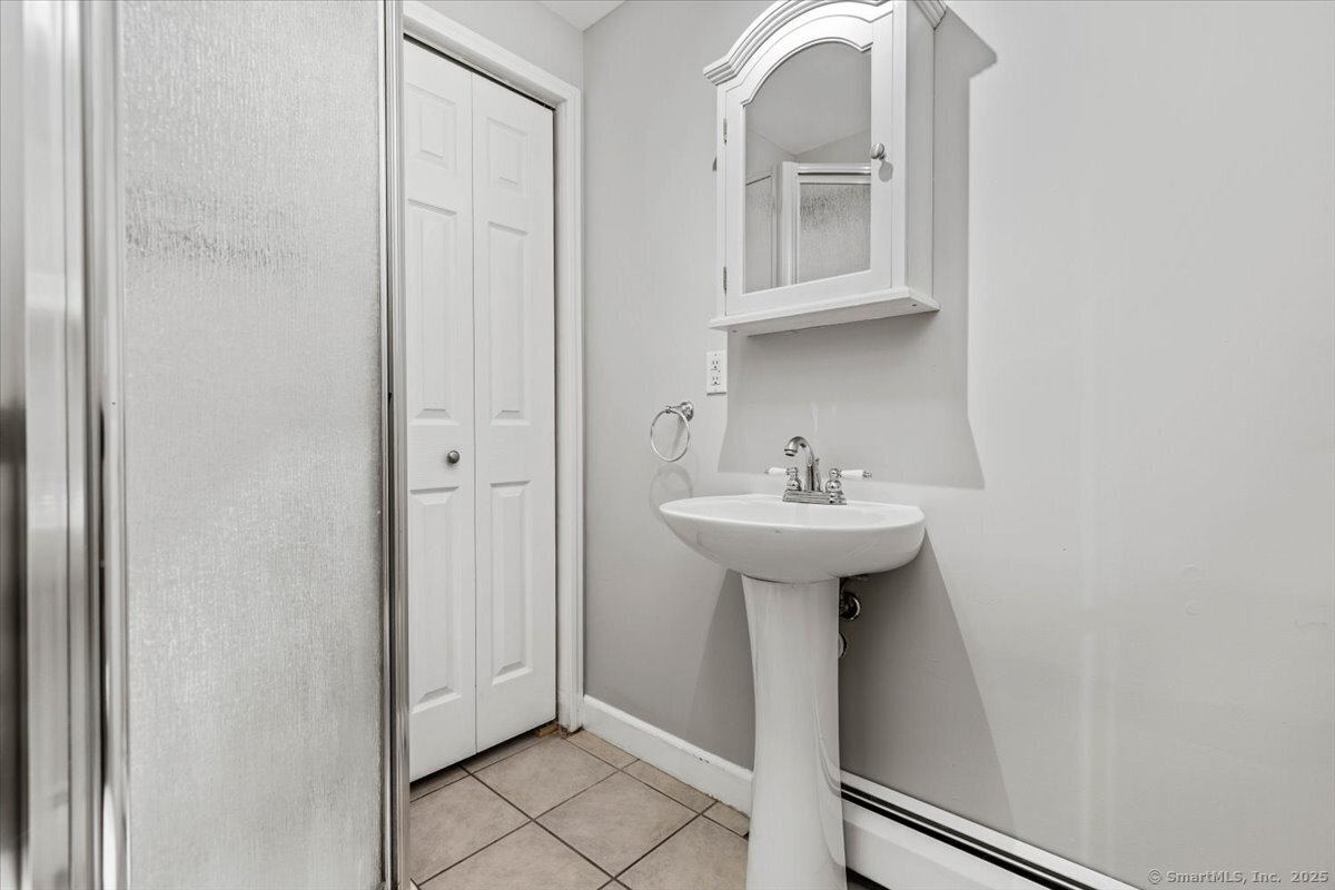 136 Nash Street New Haven, CT 06511 - Photo 6 of 10 a bathroom with a sink and a mirror