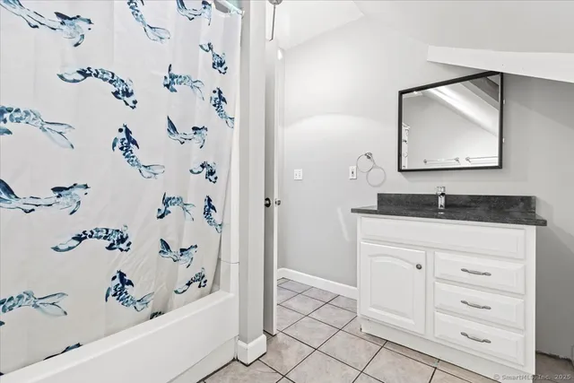 a bathroom with a bathtub and a sink