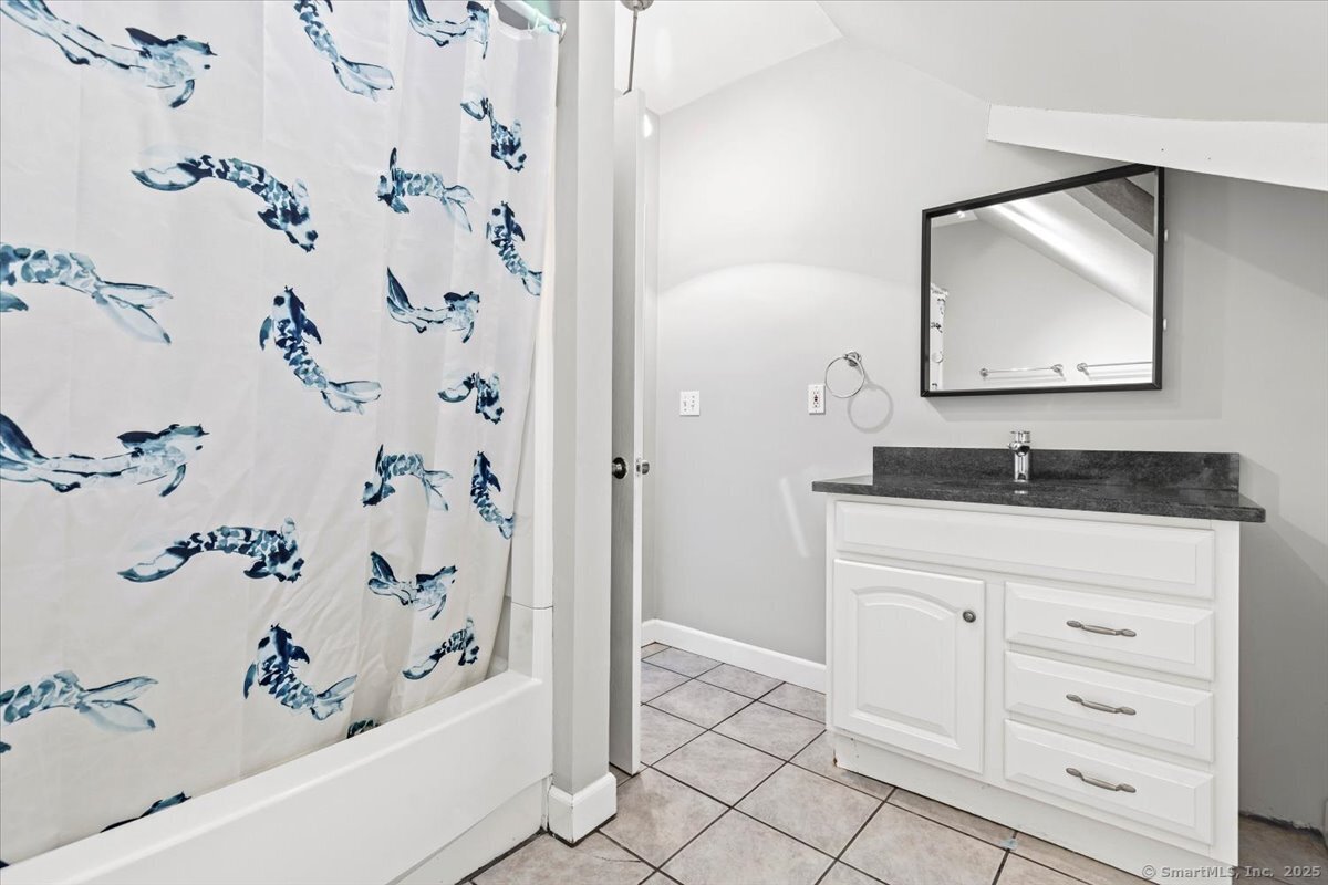 136 Nash Street New Haven, CT 06511 - Photo 9 of 10 a bathroom with a bathtub and a sink