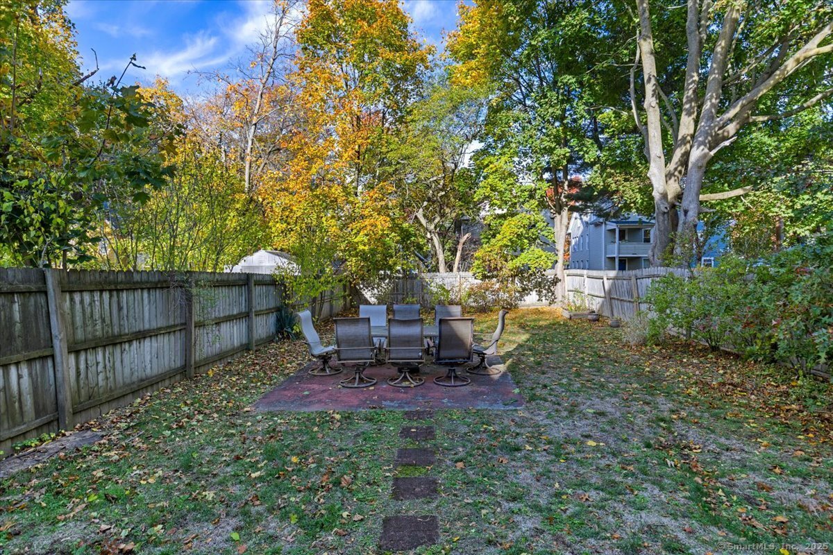 136 Nash Street New Haven, CT 06511 - Photo 10 of 10 a view of a backyard with table and chairs and a large tree
