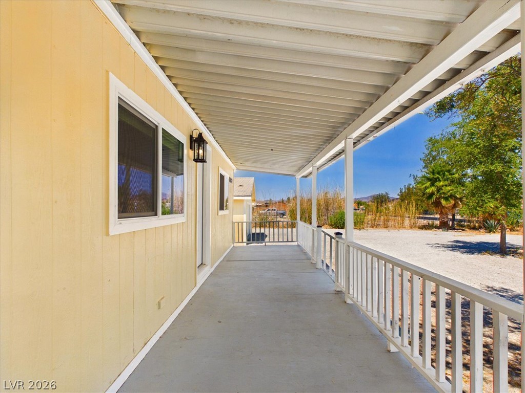 4081 Retread Road Pahrump, NV 89048 - Photo 73 of 98 A deep covered patio runs the length of this residence, offering shaded outdoor living.