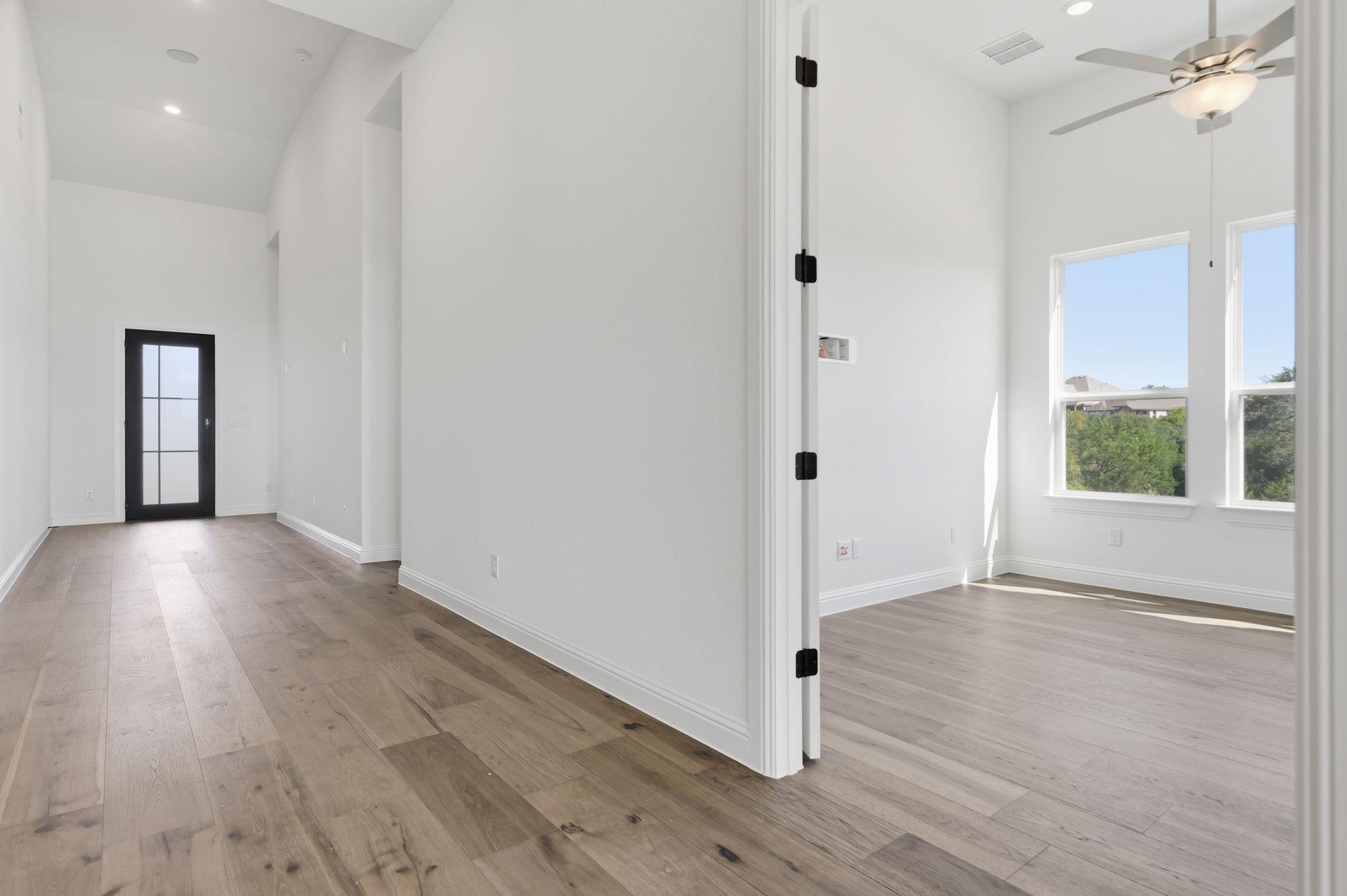 216 Moria Court Georgetown, TX 78628 - Photo 10 of 30 Foyer entrance with recessed lighting, light wood-style floors, a towering ceiling, and a ceiling fan