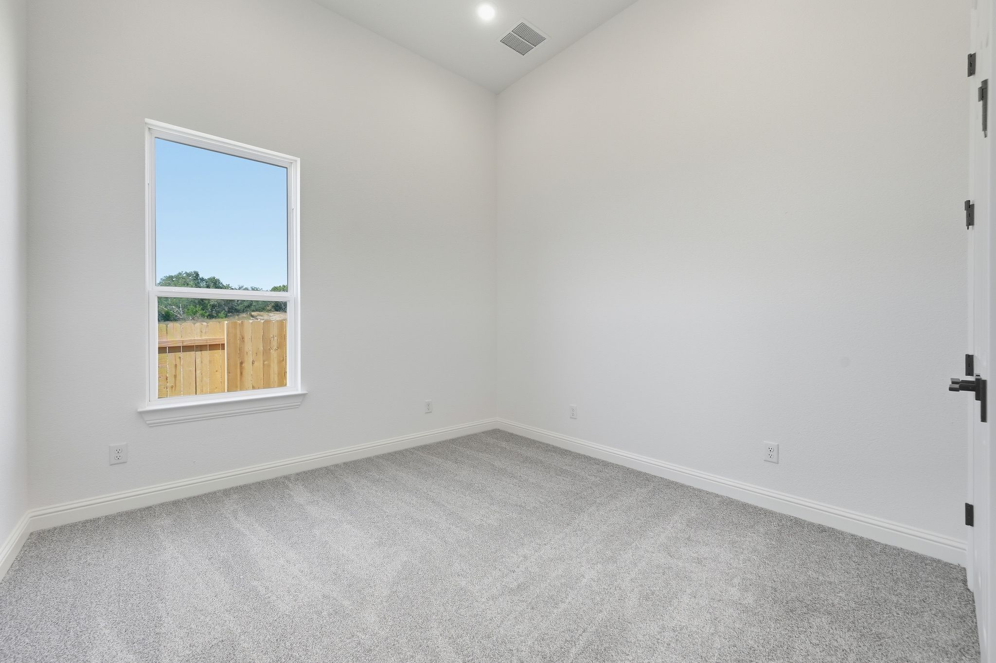 216 Moria Court Georgetown, TX 78628 - Photo 23 of 30 Empty room featuring light carpet and recessed lighting