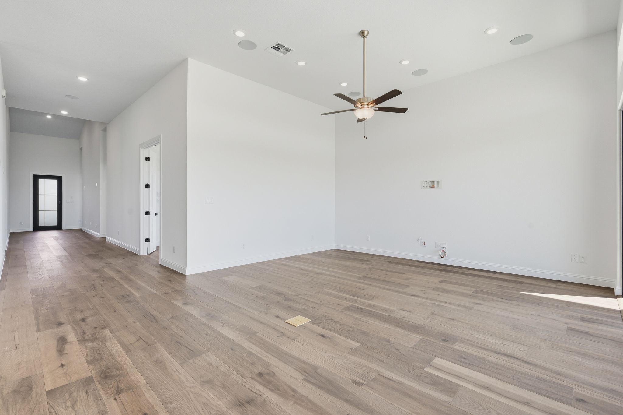 216 Moria Court Georgetown, TX 78628 - Photo 4 of 30 Spare room with recessed lighting, light wood finished floors, and a ceiling fan