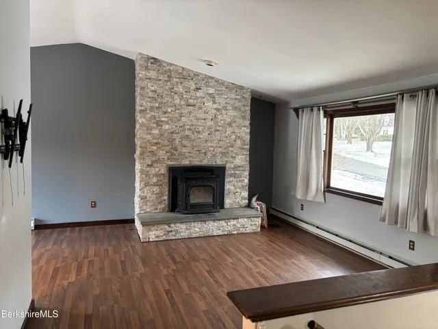 a bathroom with a sink mirror vanity and toilet