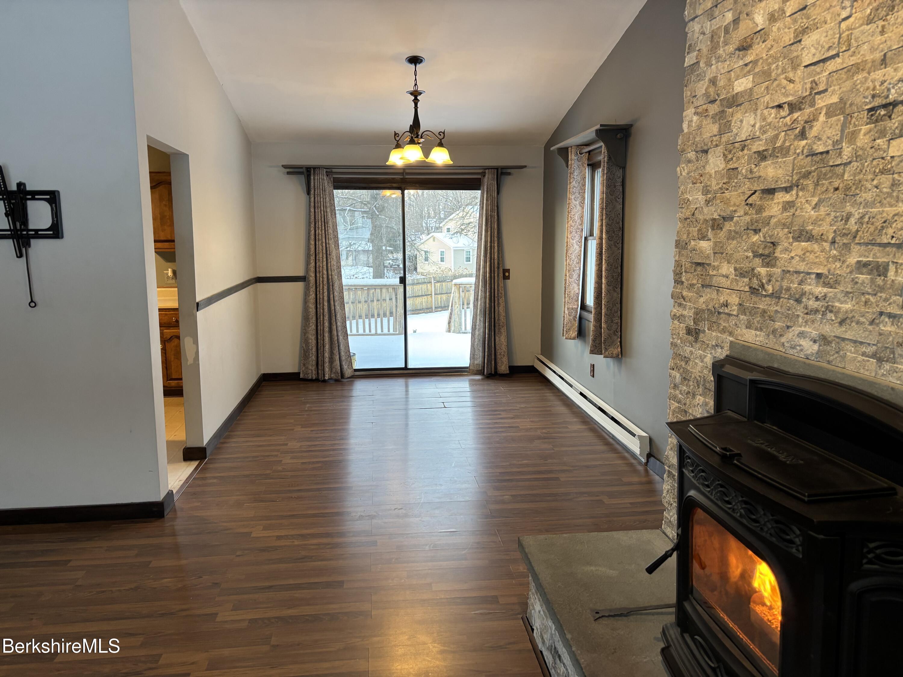 39 Barton Hill Road Dalton, MA 01226 - Photo 16 of 38 a view of an empty room with wooden floor and a window