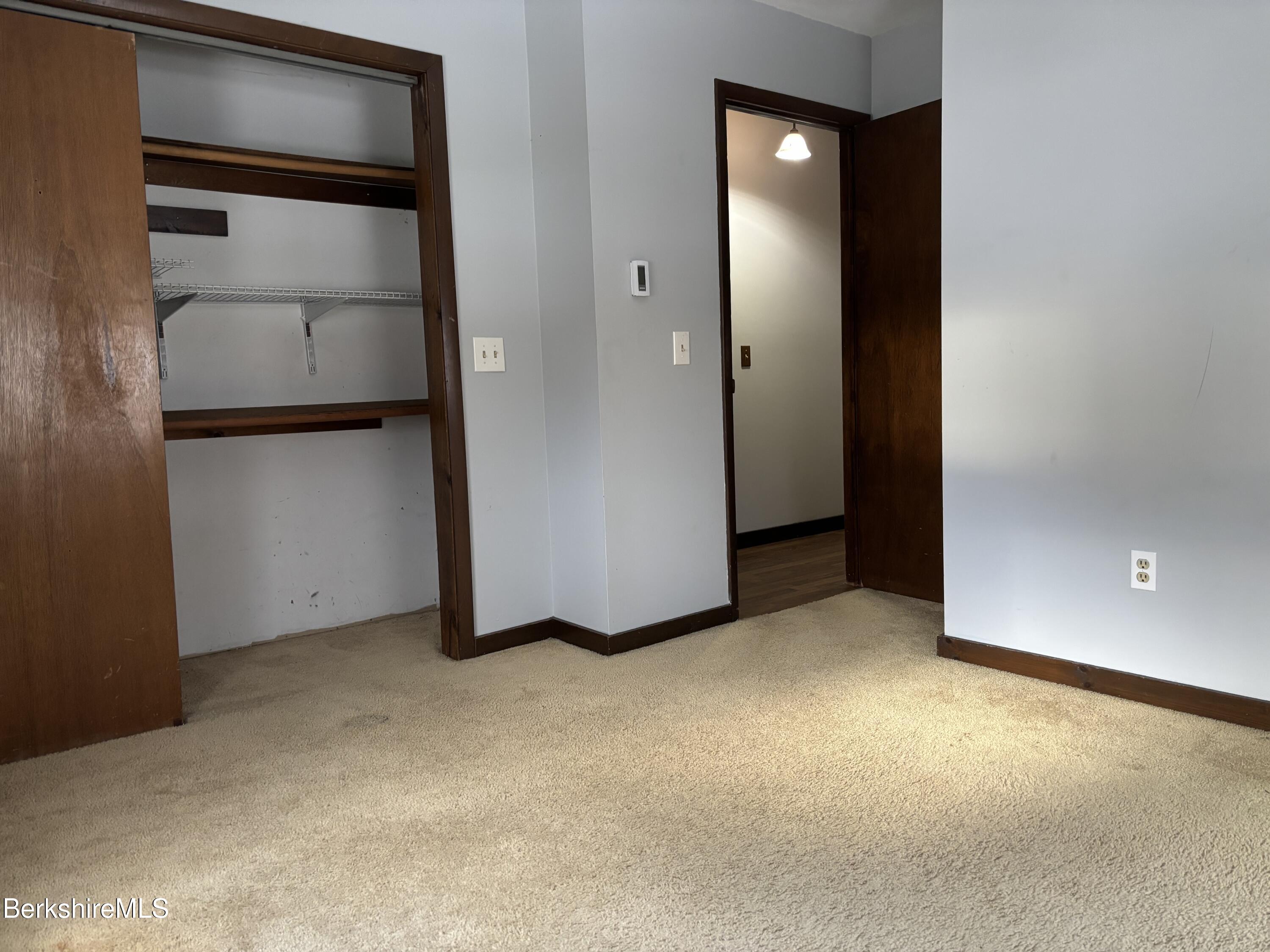 39 Barton Hill Road Dalton, MA 01226 - Photo 19 of 38 a view of an empty room with closet and cabinet