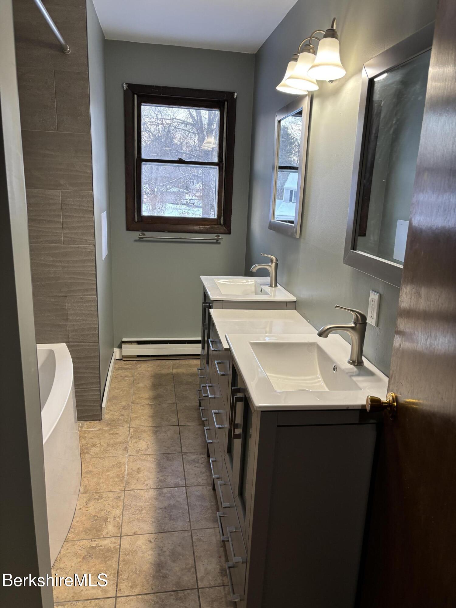39 Barton Hill Road Dalton, MA 01226 - Photo 21 of 38 a bathroom with a sink a toilet and mirror