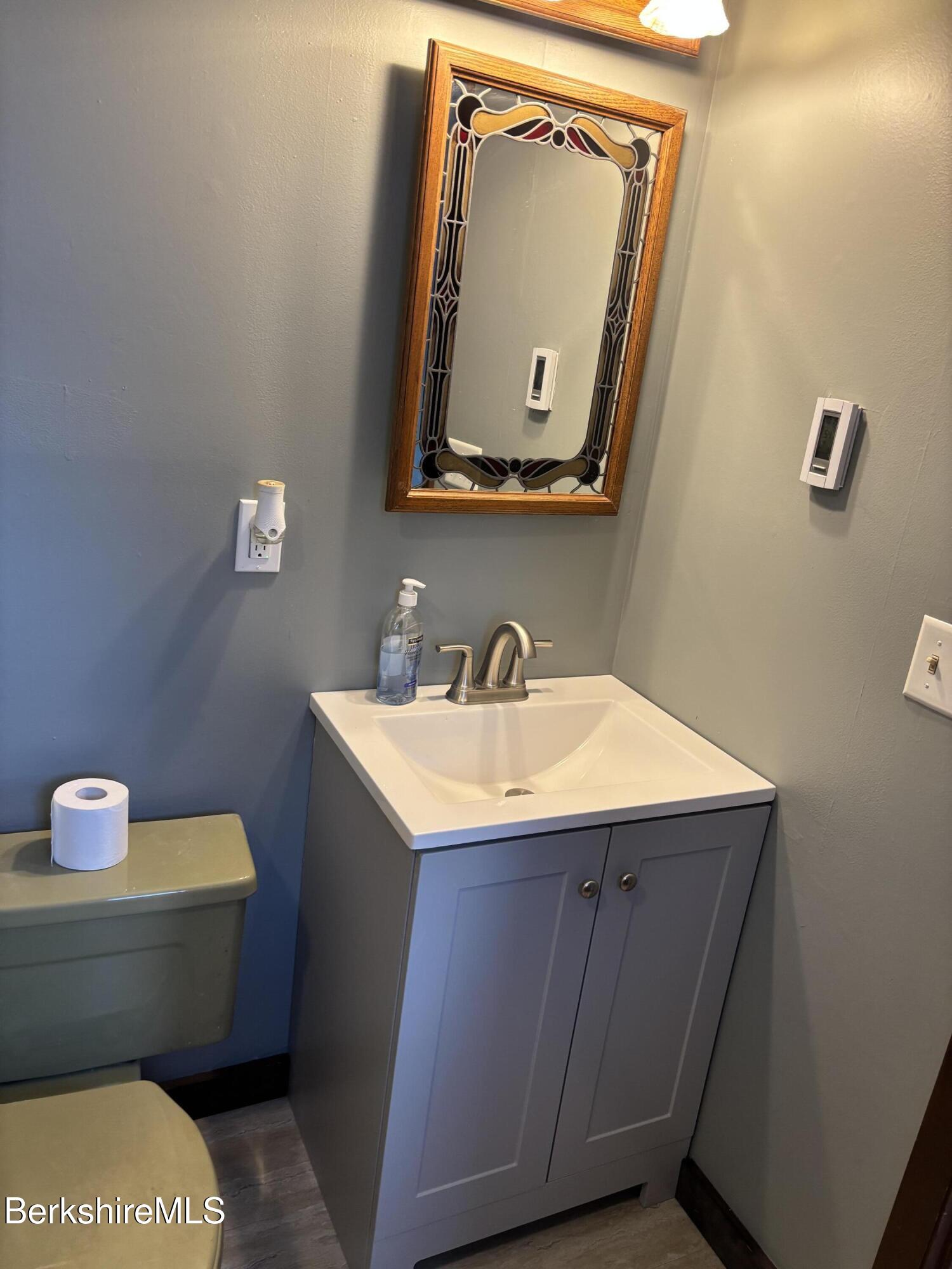 39 Barton Hill Road Dalton, MA 01226 - Photo 29 of 38 a bathroom with a toilet sink and mirror