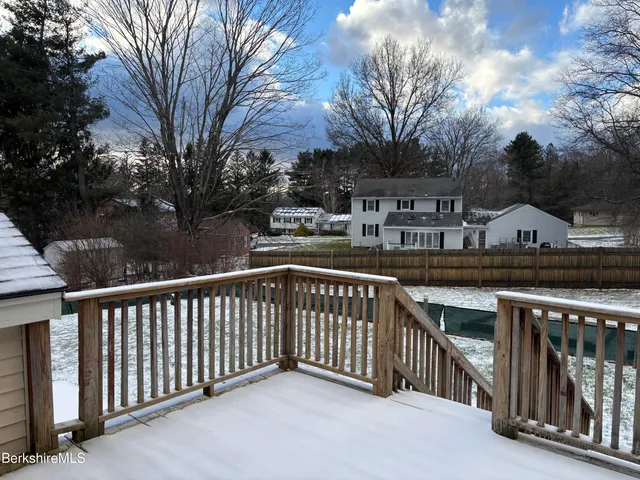 a view of a livingroom with furniture and wooden floor