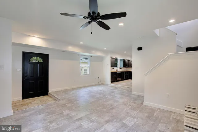 an empty space with kitchen view