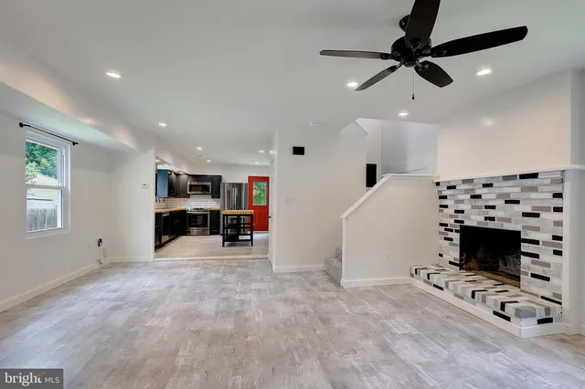 a view of a livingroom with furniture and a fireplace