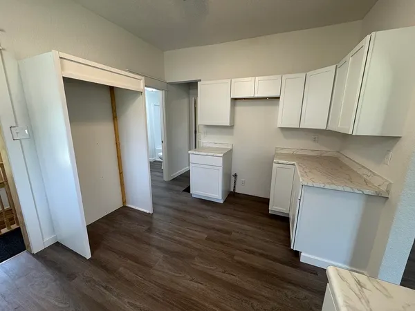 a kitchen with sink cabinets and window
