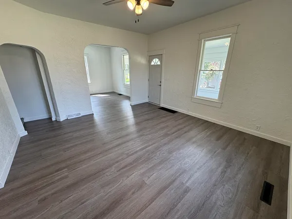 a view of a livingroom with wooden floor