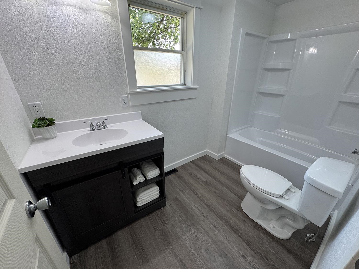 101 East Division Road Shannon, IL 61078 - Photo 31 of 52 a bathroom with a sink toilet and tub