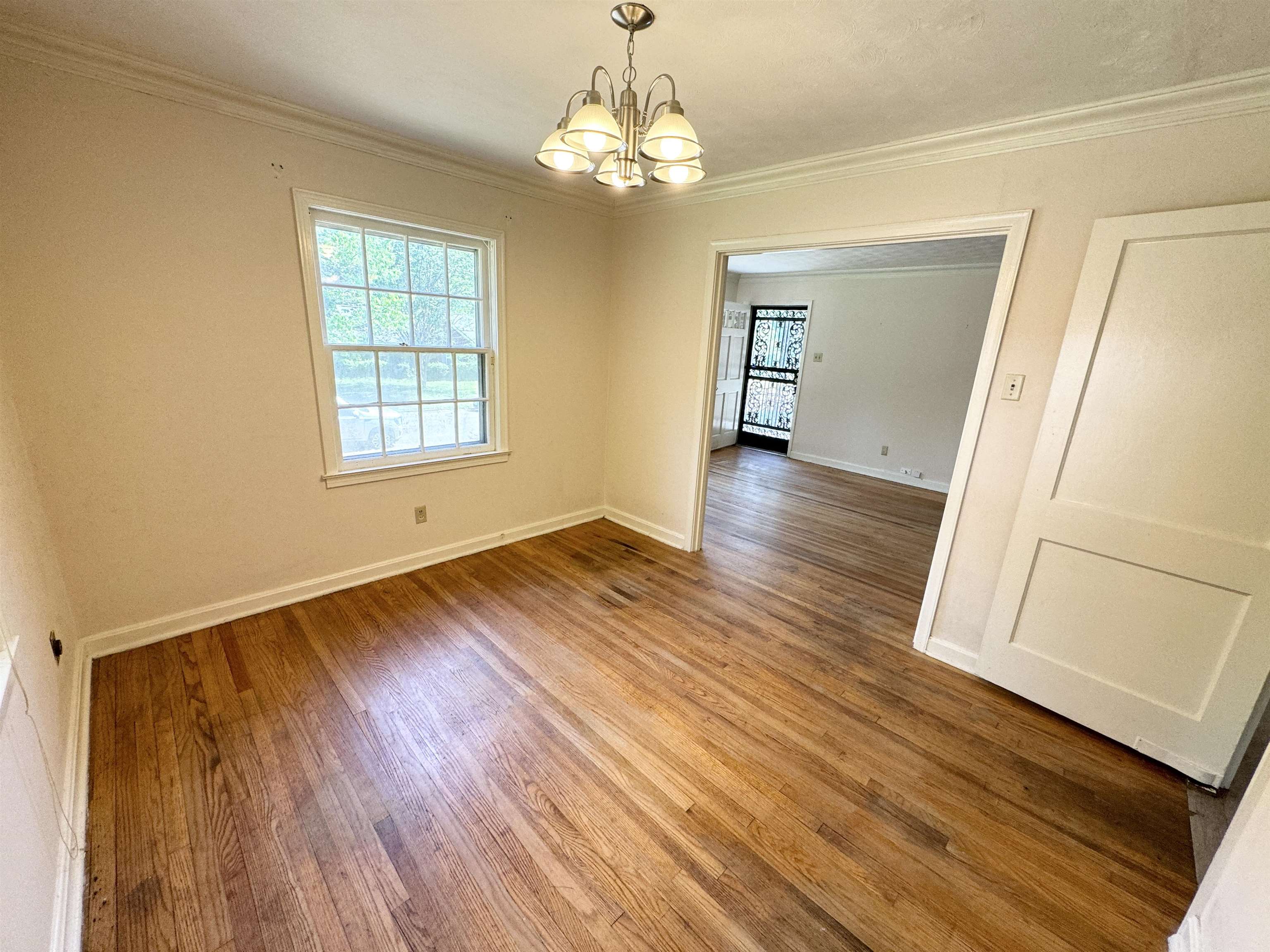 3777 Healey Road Memphis, TN 38111 - Photo 7 of 15 wooden floor in an empty room with a window