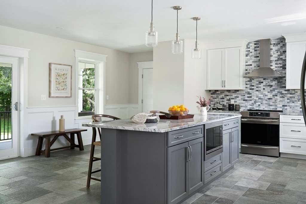 70 Depot Road Hatfield, MA 01038 - Photo 15 of 42 a kitchen with a sink stove and cabinets