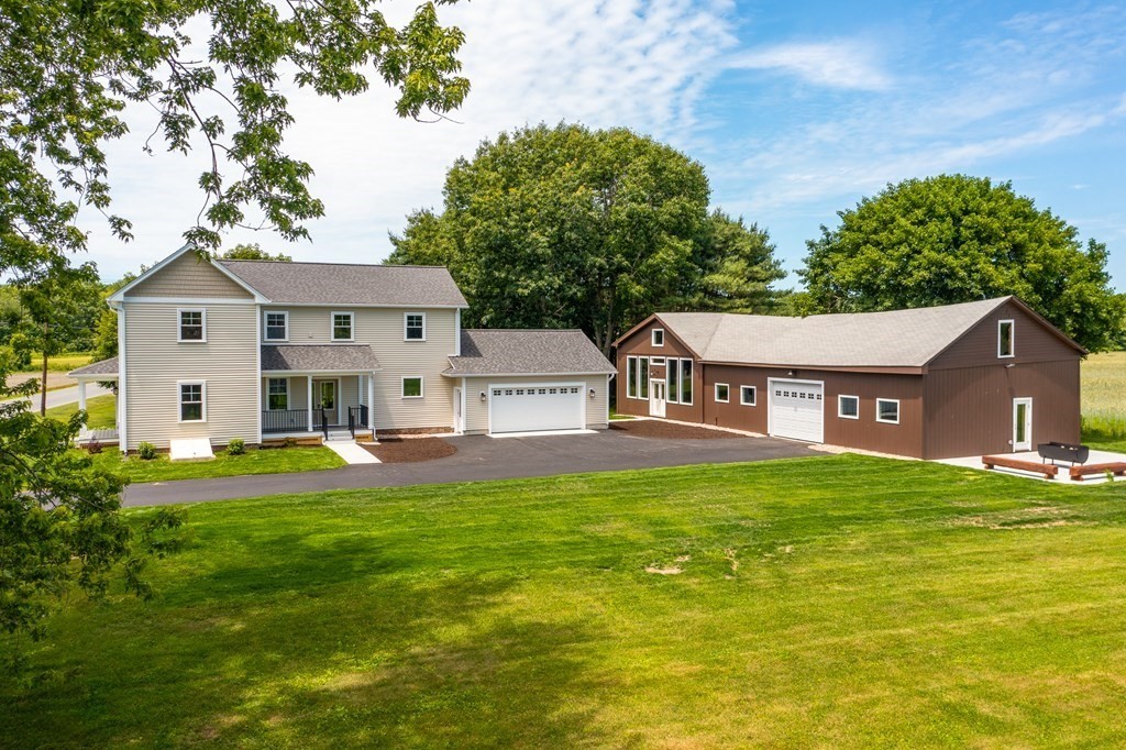 70 Depot Road Hatfield, MA 01038 - Photo 3 of 42 a view of a house with a big yard potted plants and large tree