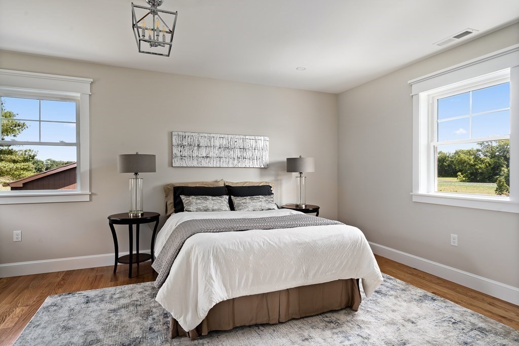 70 Depot Road Hatfield, MA 01038 - Photo 31 of 42 a bed sitting in a bedroom next to a window