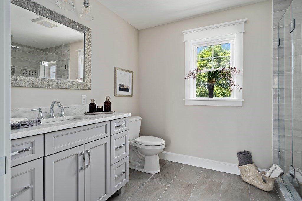 70 Depot Road Hatfield, MA 01038 - Photo 36 of 42 a bathroom with a toilet sink and mirror