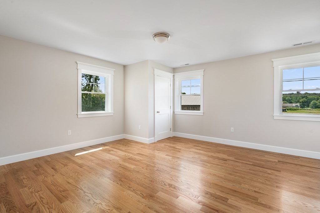70 Depot Road Hatfield, MA 01038 - Photo 39 of 42 a view of an empty room with wooden floor and a window