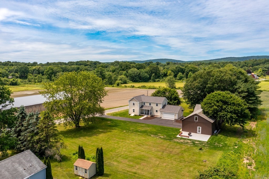70 Depot Road Hatfield, MA 01038 - Photo 5 of 42 an aerial view of a house with swimming pool lake and mountain view
