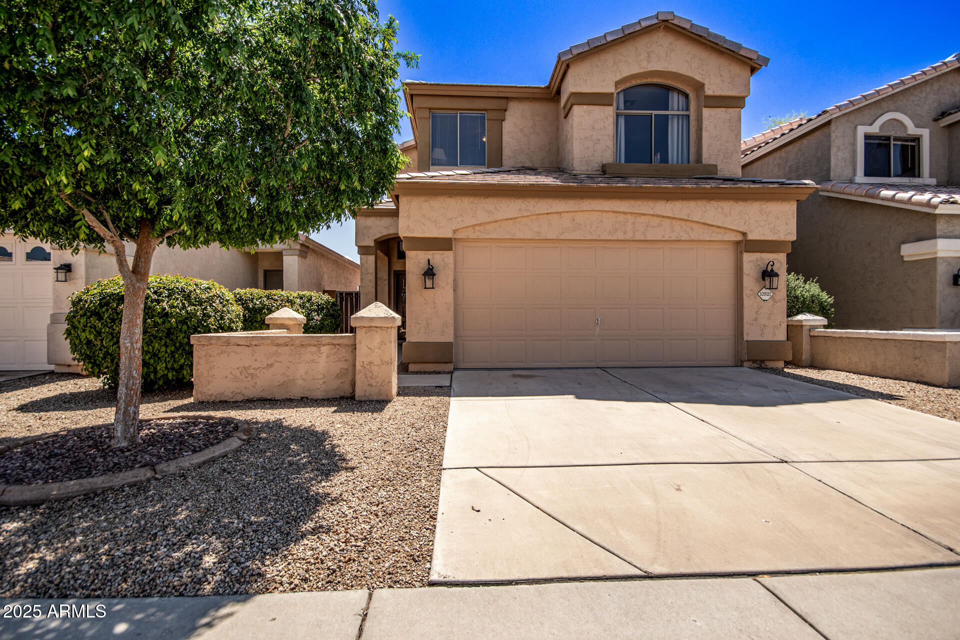 a front view of a house with garage