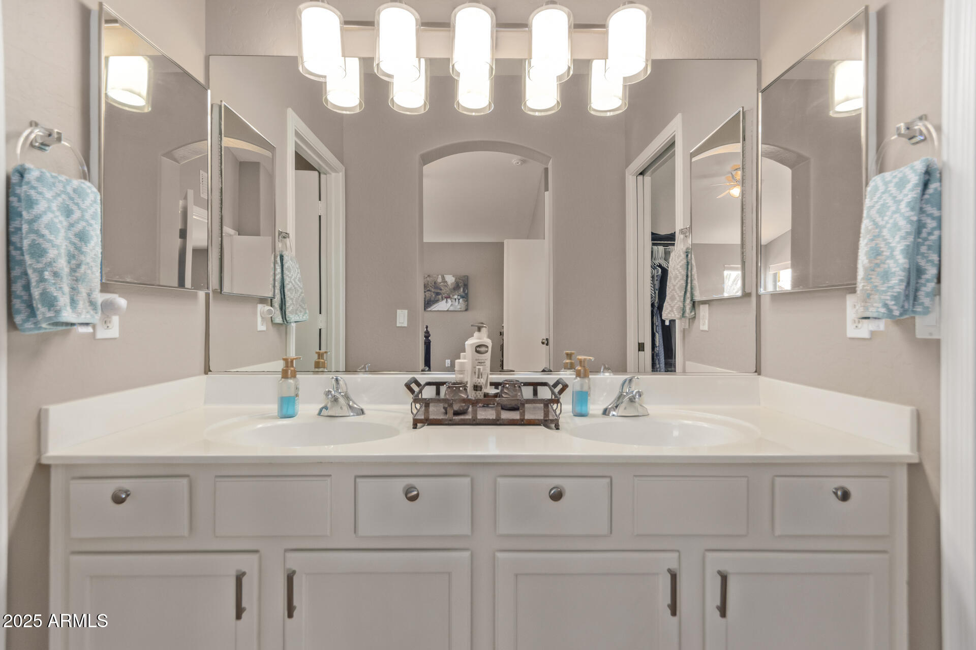10521 West Berkeley Road Avondale, AZ 85392 - Photo 11 of 21 a bathroom with a sink vanity and a mirror