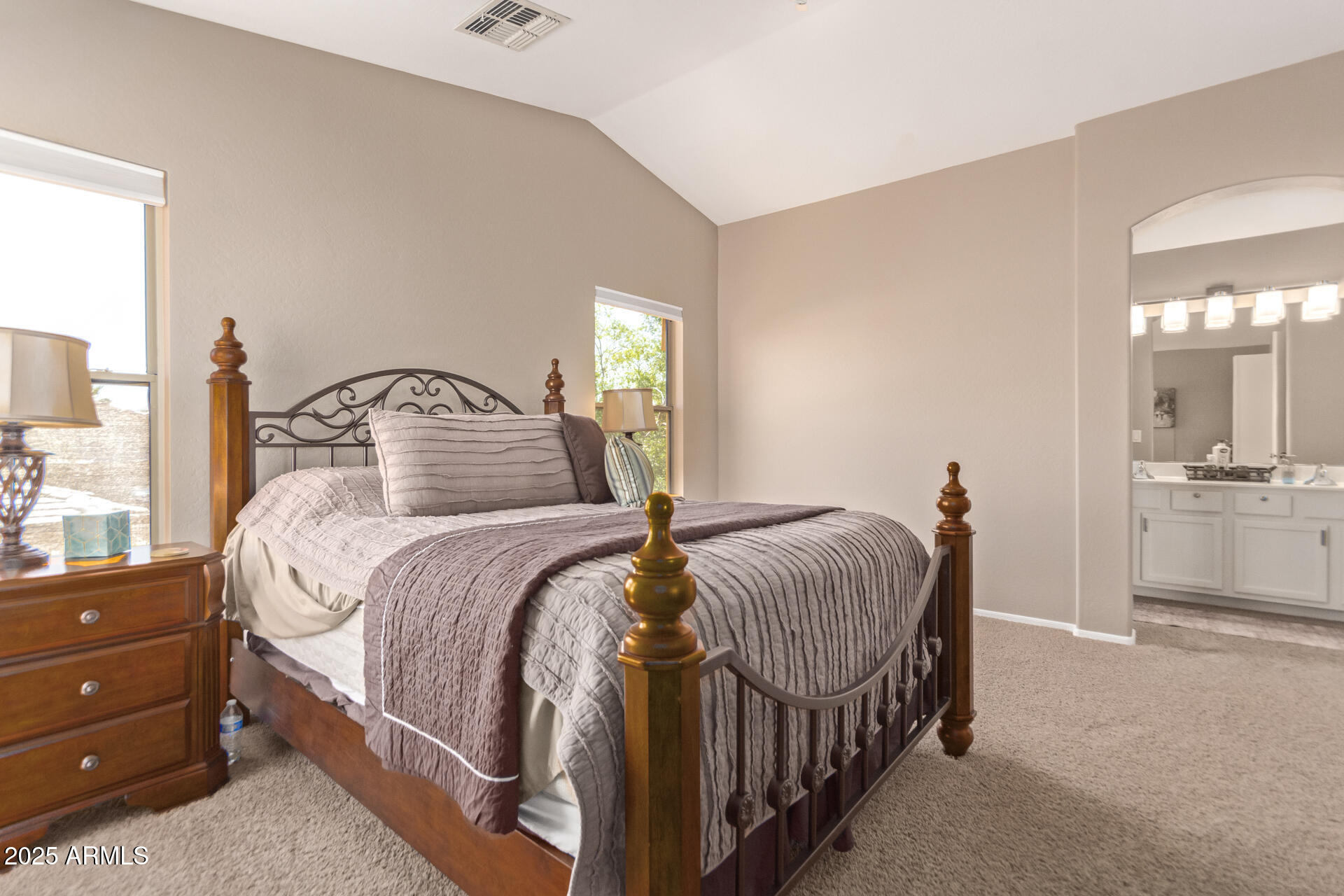 10521 West Berkeley Road Avondale, AZ 85392 - Photo 13 of 21 a bedroom with a bed and a mirror