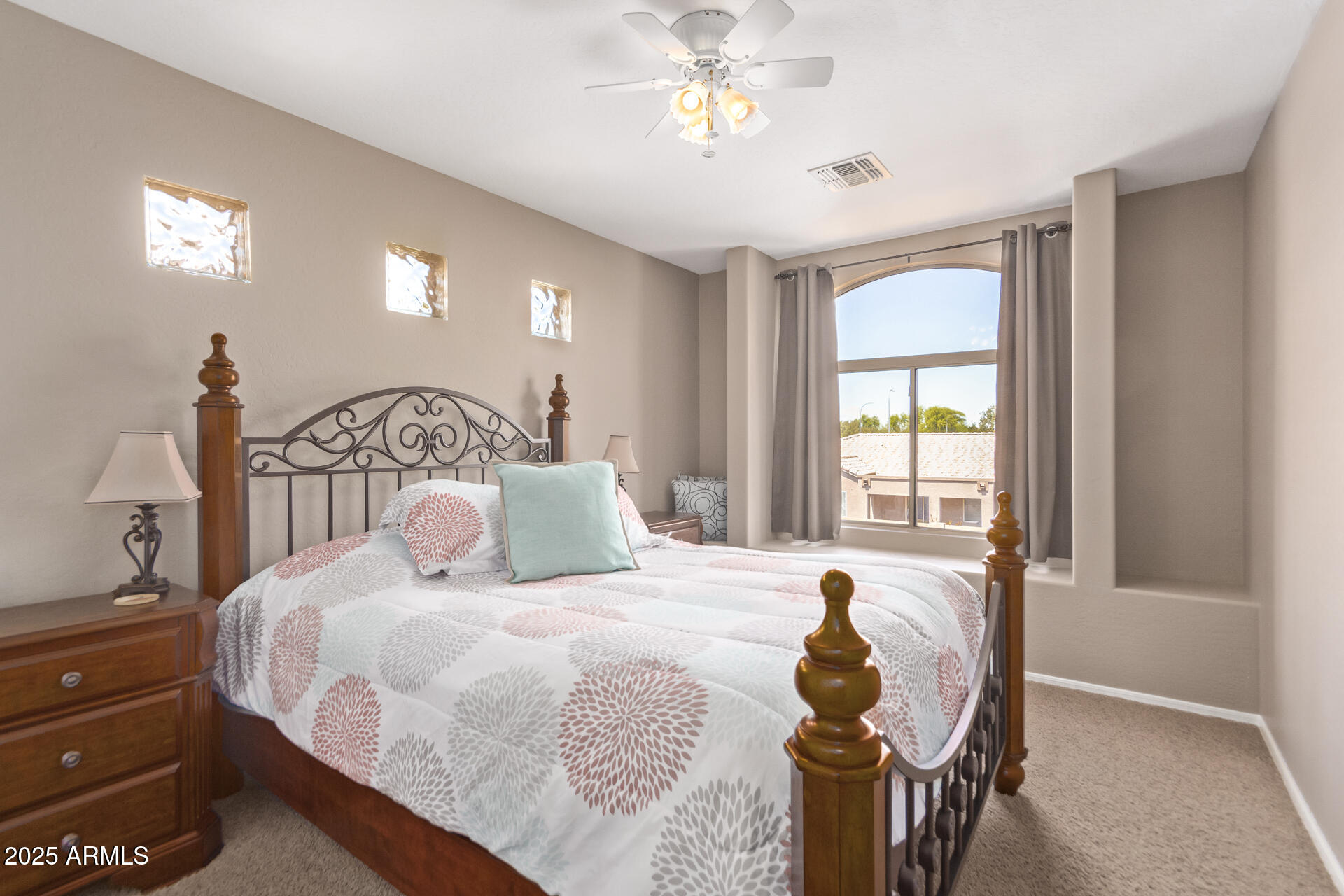 10521 West Berkeley Road Avondale, AZ 85392 - Photo 14 of 21 a bedroom with a bed and a window
