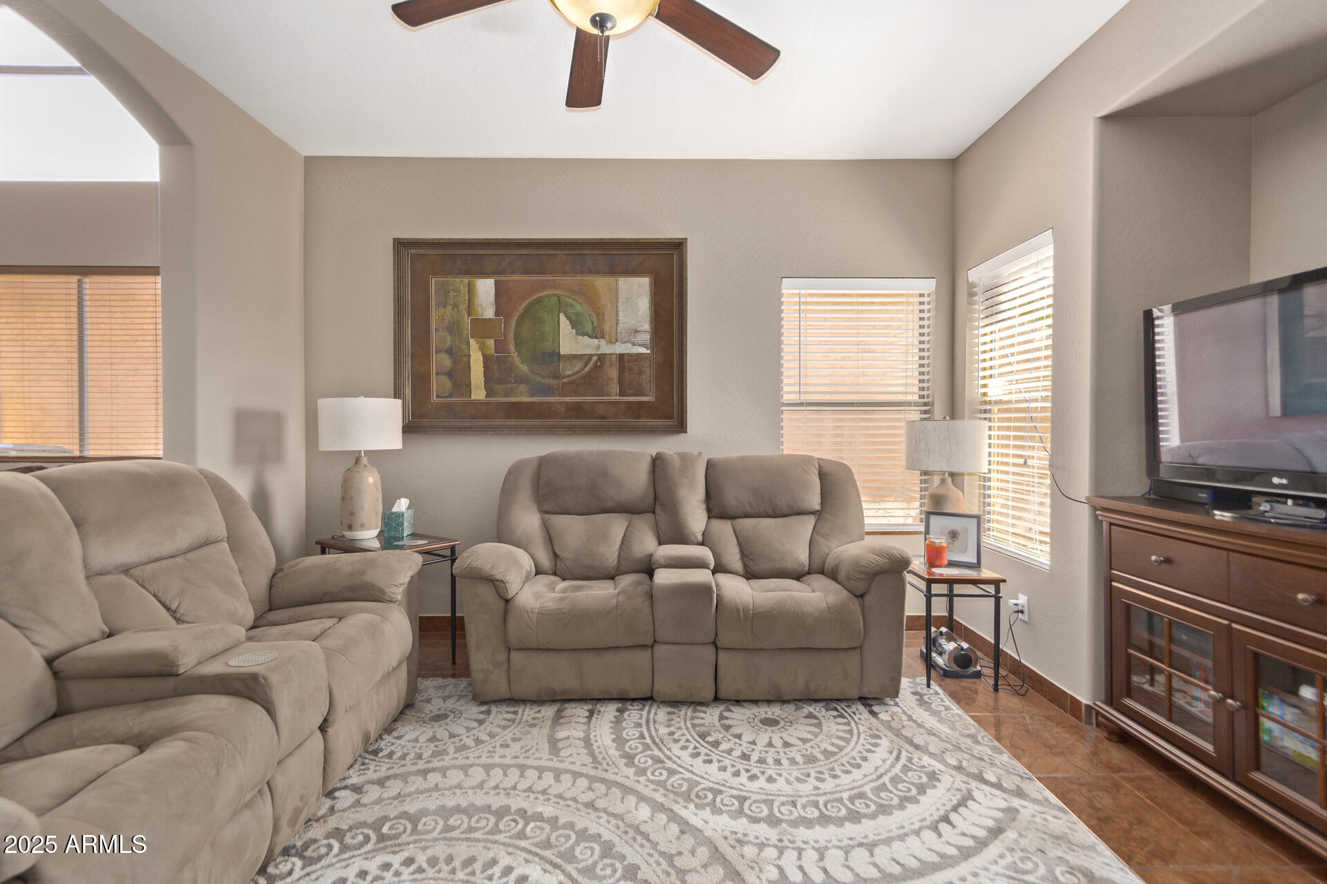 10521 West Berkeley Road Avondale, AZ 85392 - Photo 3 of 21 a living room with furniture and a flat screen tv