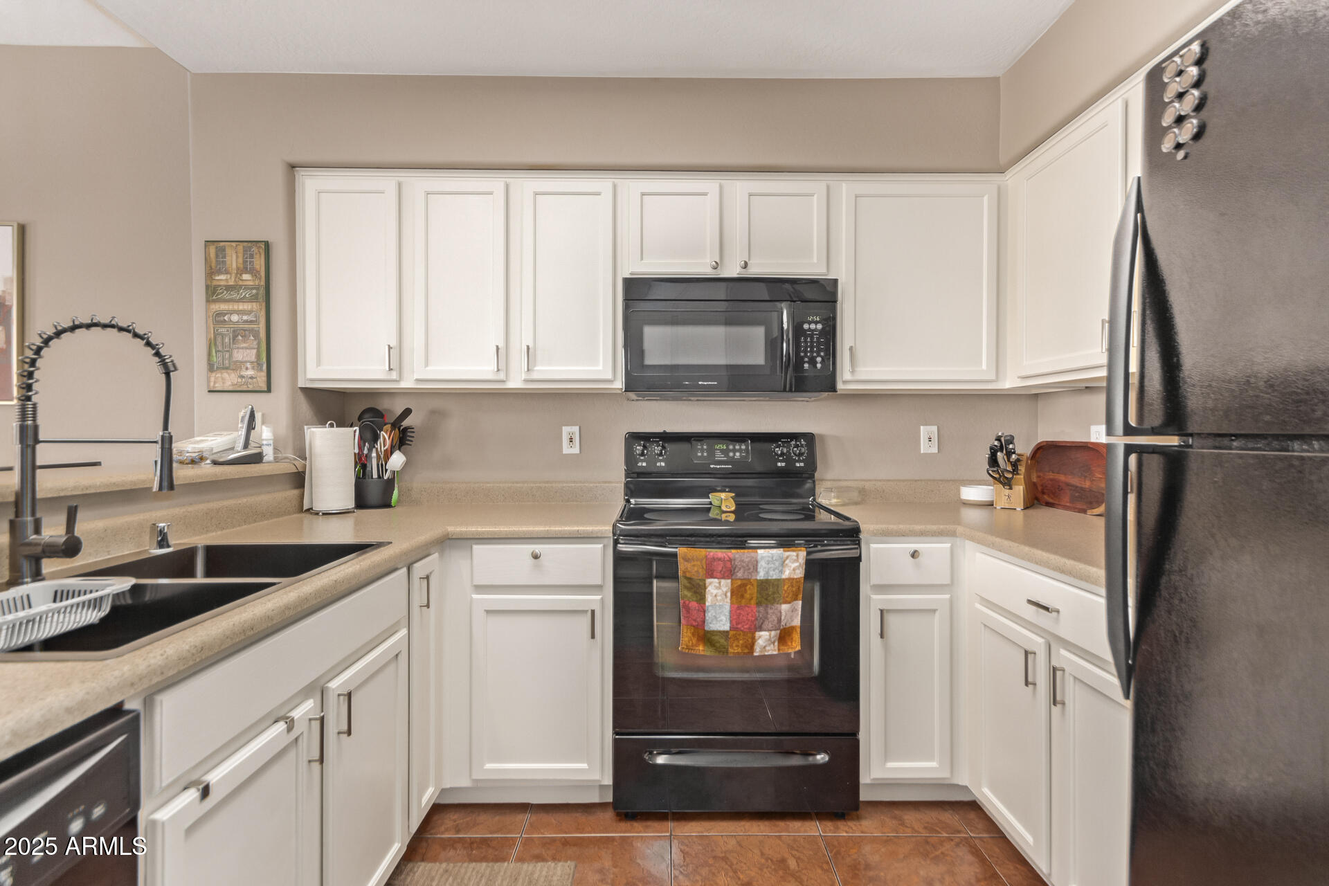 10521 West Berkeley Road Avondale, AZ 85392 - Photo 6 of 21 a kitchen with a sink stove and refrigerator