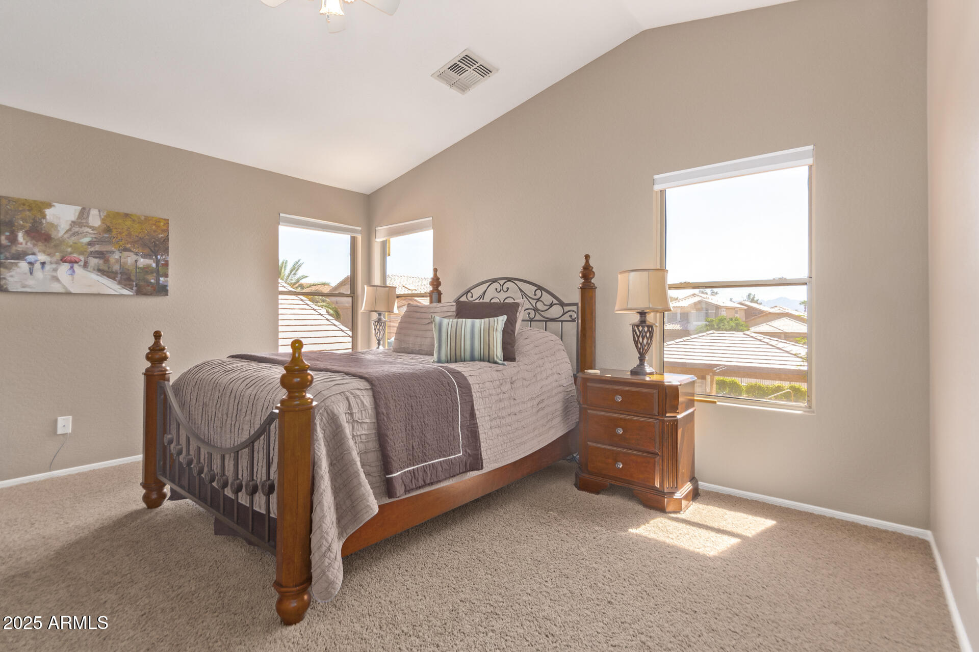 10521 West Berkeley Road Avondale, AZ 85392 - Photo 8 of 21 a bedroom with a bed and a window
