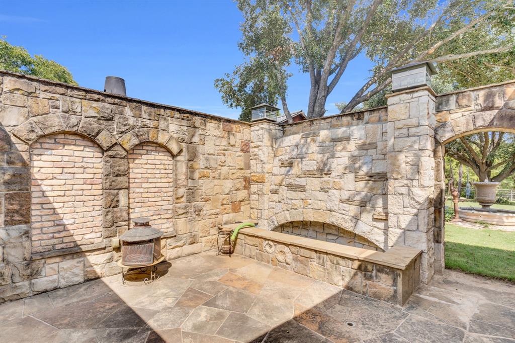 490 James Road Ferris, TX 75125 - Photo 21 of 40 Master suite private patio with waterfall wall