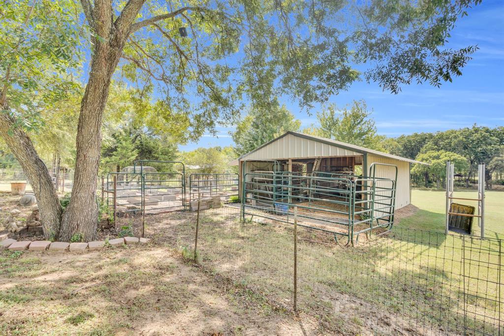 490 James Road Ferris, TX 75125 - Photo 32 of 40 Horse barn with stocks