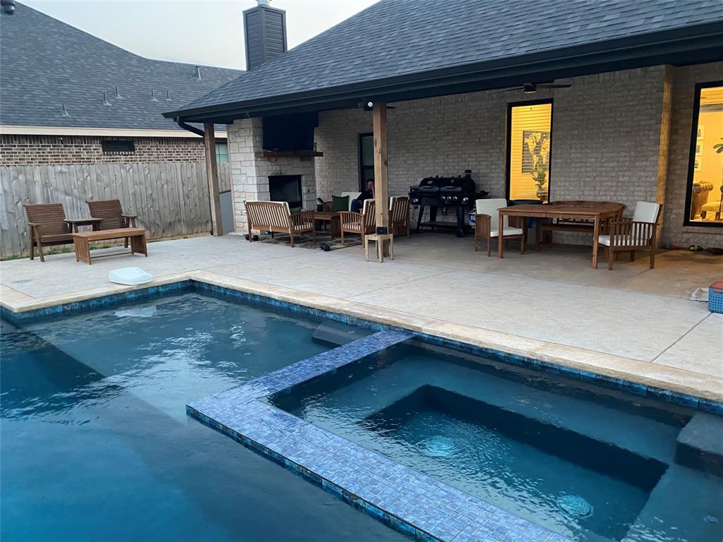 a kitchen with furniture and a large window