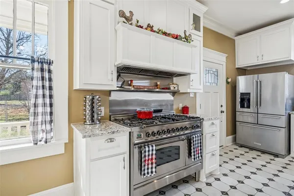 a kitchen with stainless steel appliances a stove and a refrigerator