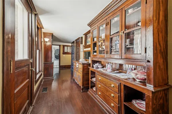 a view of a kitchen with stainless steel appliances granite countertop a refrigerator and a stove top oven